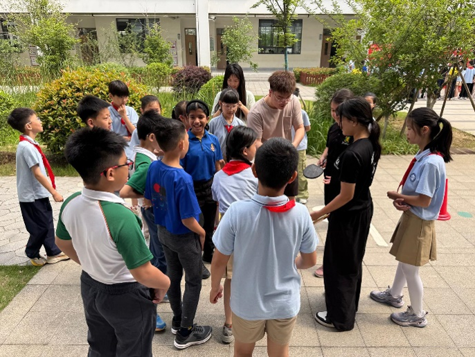 Students interacting with peers during an overseas cultural exchange activity.
